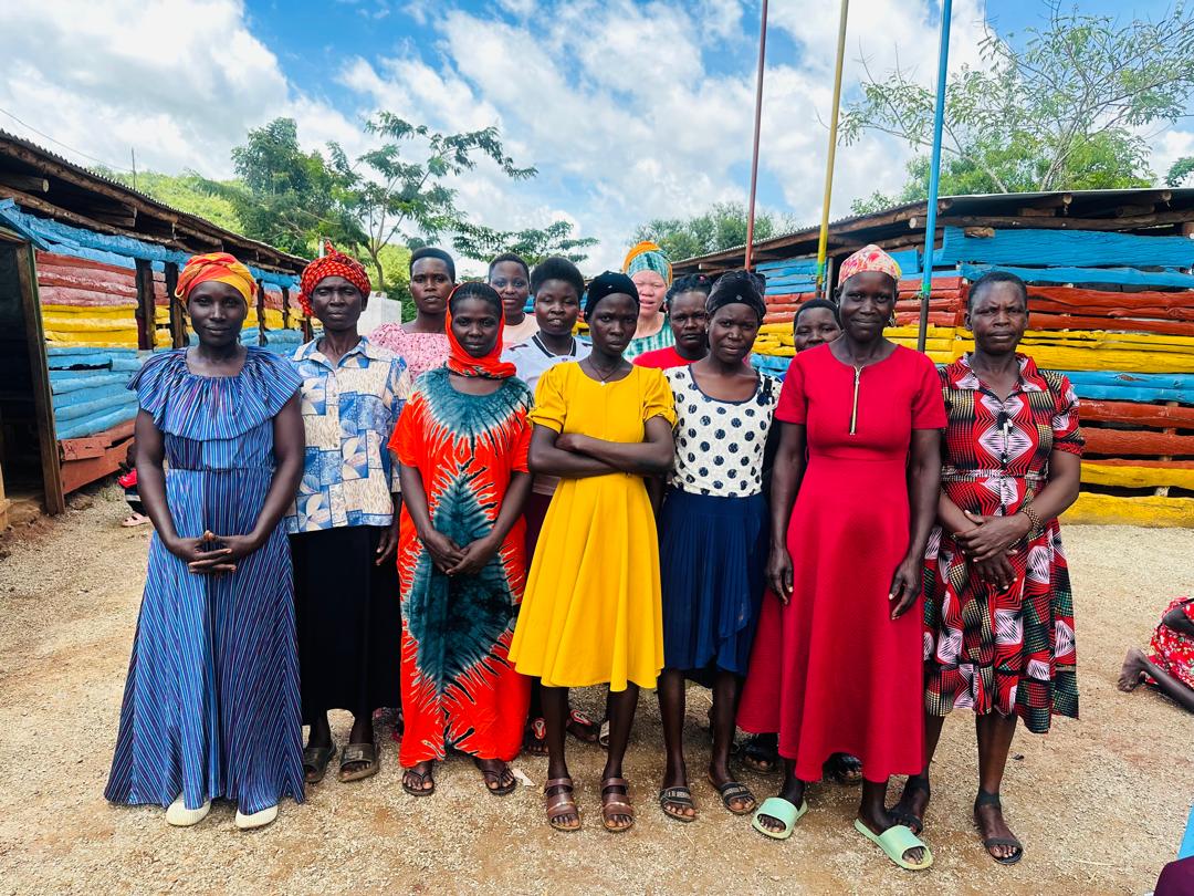 Women and caregivers standing together in a community setting